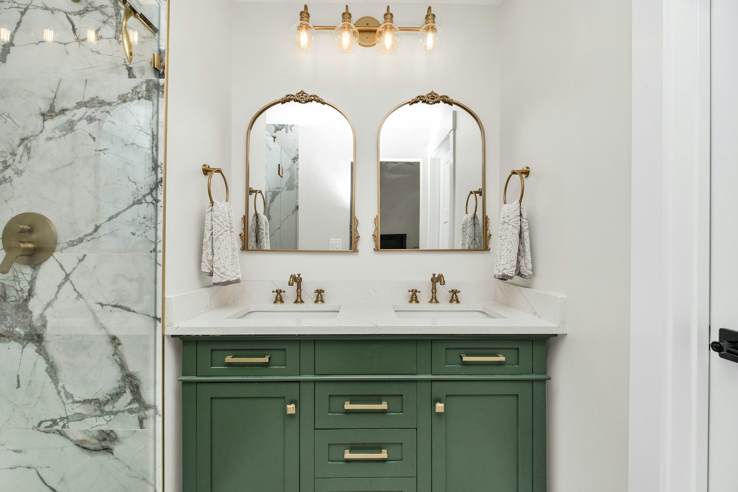 Bathroom vanity with marble countertop and contemporary cabinet finish detail