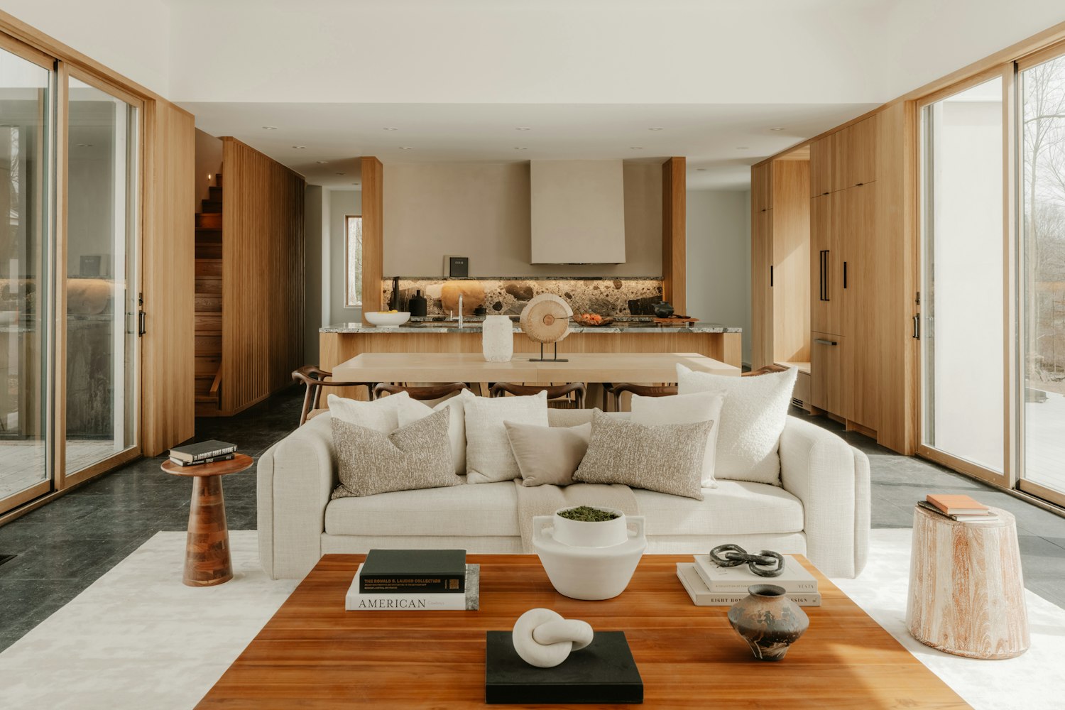 Open-concept interior with warm wood flooring — Houston remodeling
