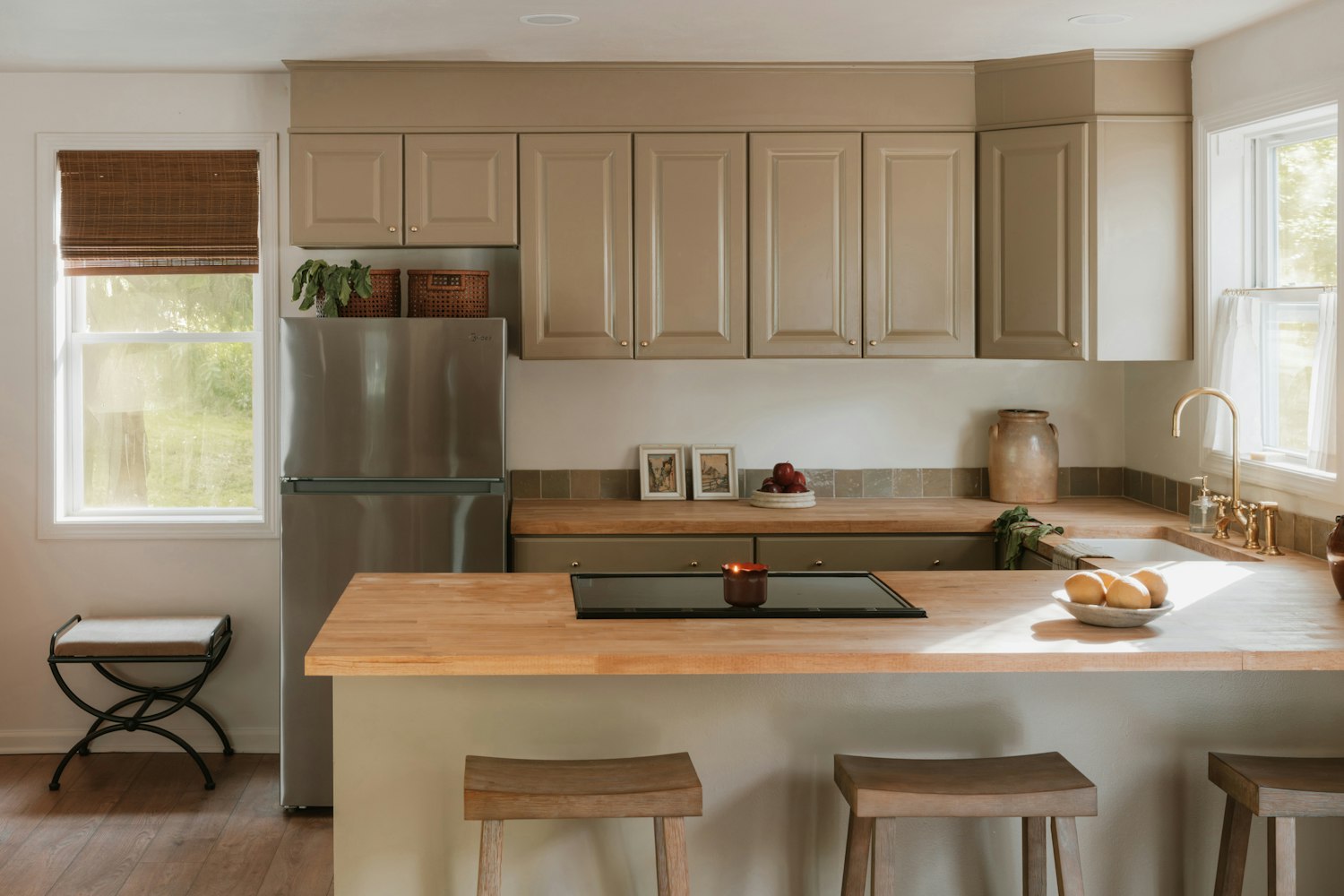 Modern kitchen with light wood countertops and open island layout